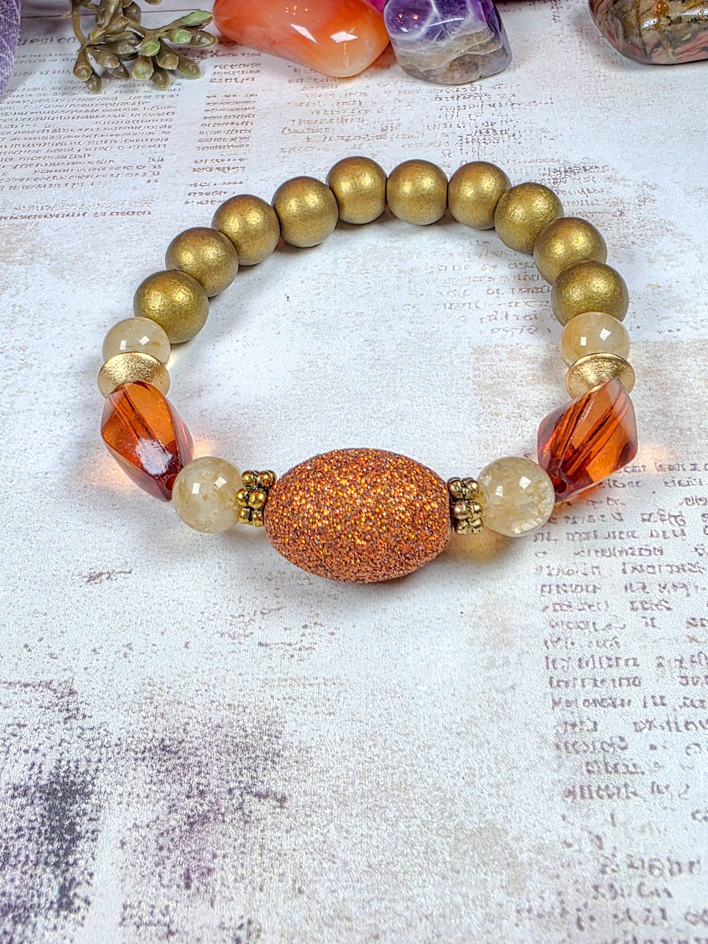 Earthy terracotta beaded stretch bracelet with burnt orange acrylic and bronze-gold wood beads