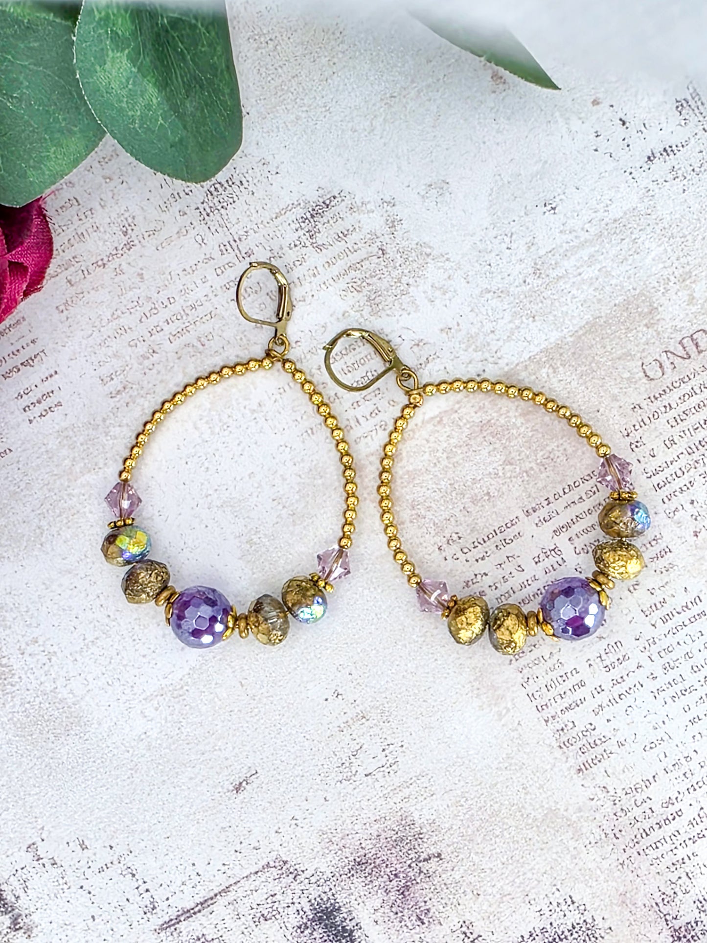 Amethyst hoop earrings featuring genuine Swarovski crystal components, Czech glass beads, and brass accents.