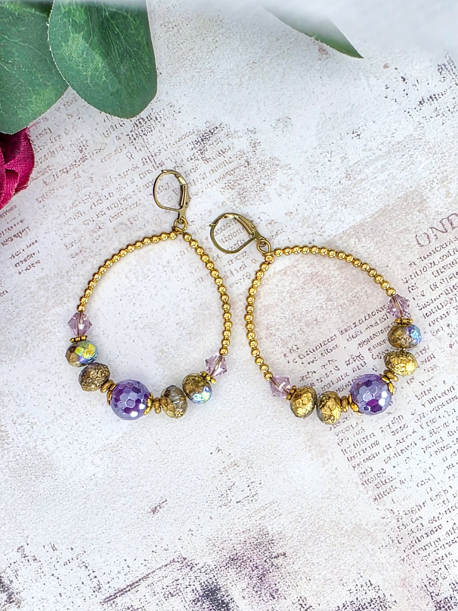 Amethyst hoop earrings featuring genuine Swarovski crystal components, Czech glass beads, and brass accents.