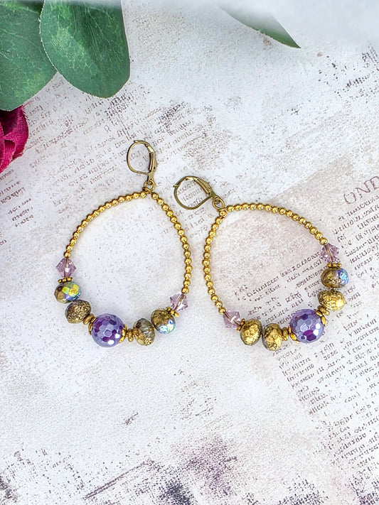 Amethyst hoop earrings featuring genuine Swarovski crystal components, Czech glass beads, and brass accents.