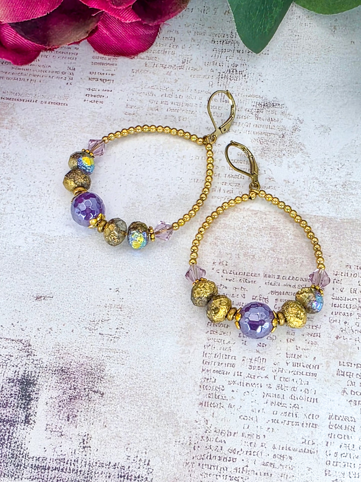 Amethyst hoop earrings featuring genuine Swarovski crystal components, Czech glass beads, and brass accents.
