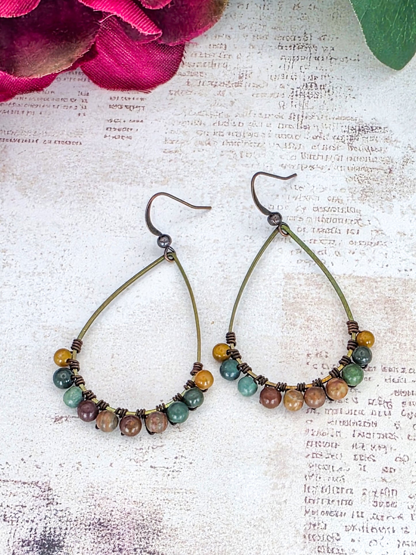 Fancy Jasper gemstone earrings with brass teardrop hoops in earthy green, brown, mustard, and mauve tones.