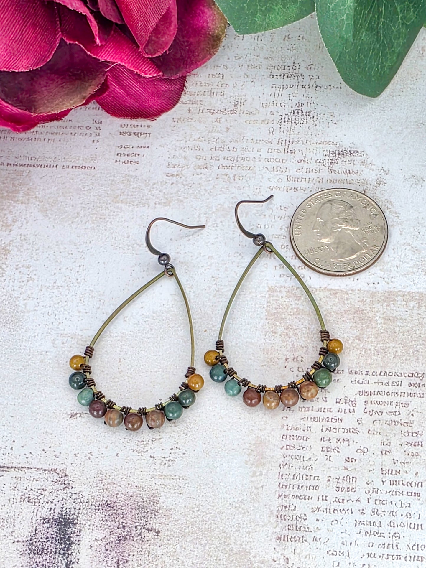 Fancy Jasper gemstone earrings with brass teardrop hoops in earthy green, brown, mustard, and mauve tones.