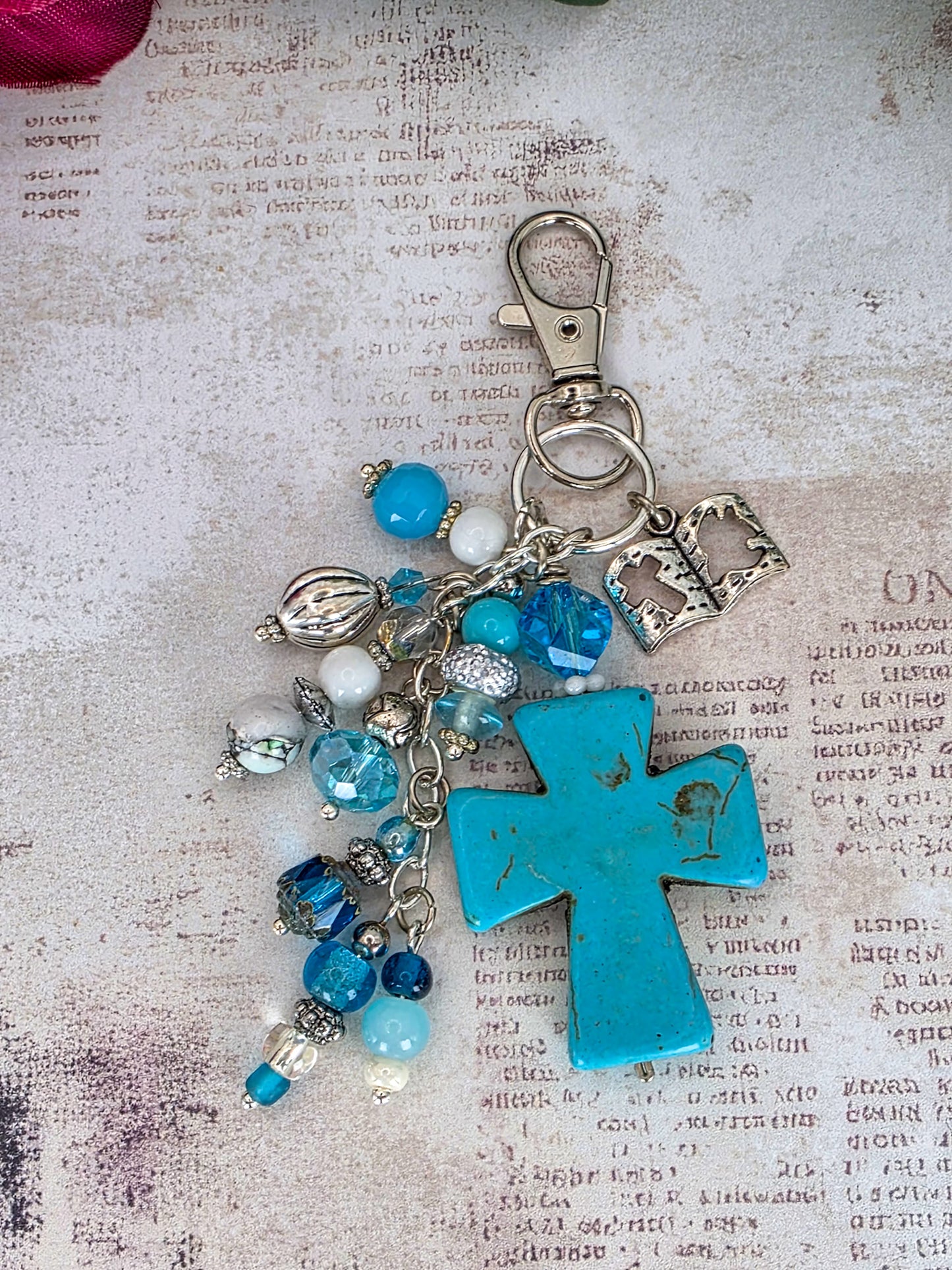 Handcrafted turquoise howlite cross purse charm with blue glass beads, Bible charm, and silver-tone keychain clip.