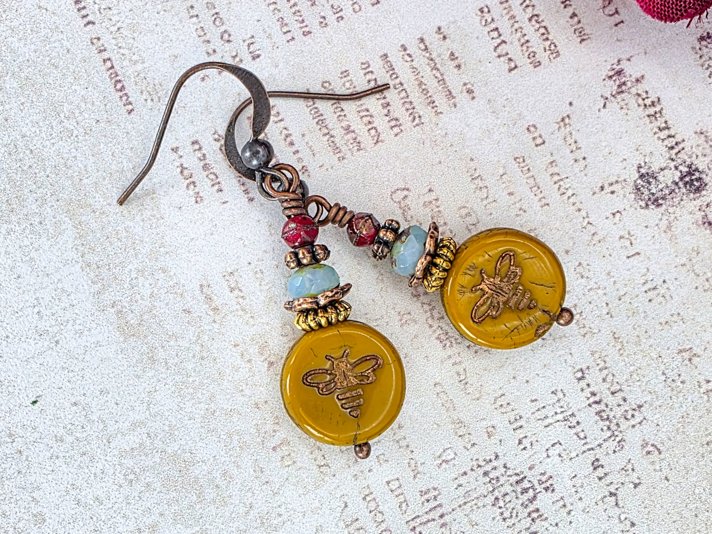 Mustard Picasso Czech glass bee earrings with copper ear wires and brass accents.