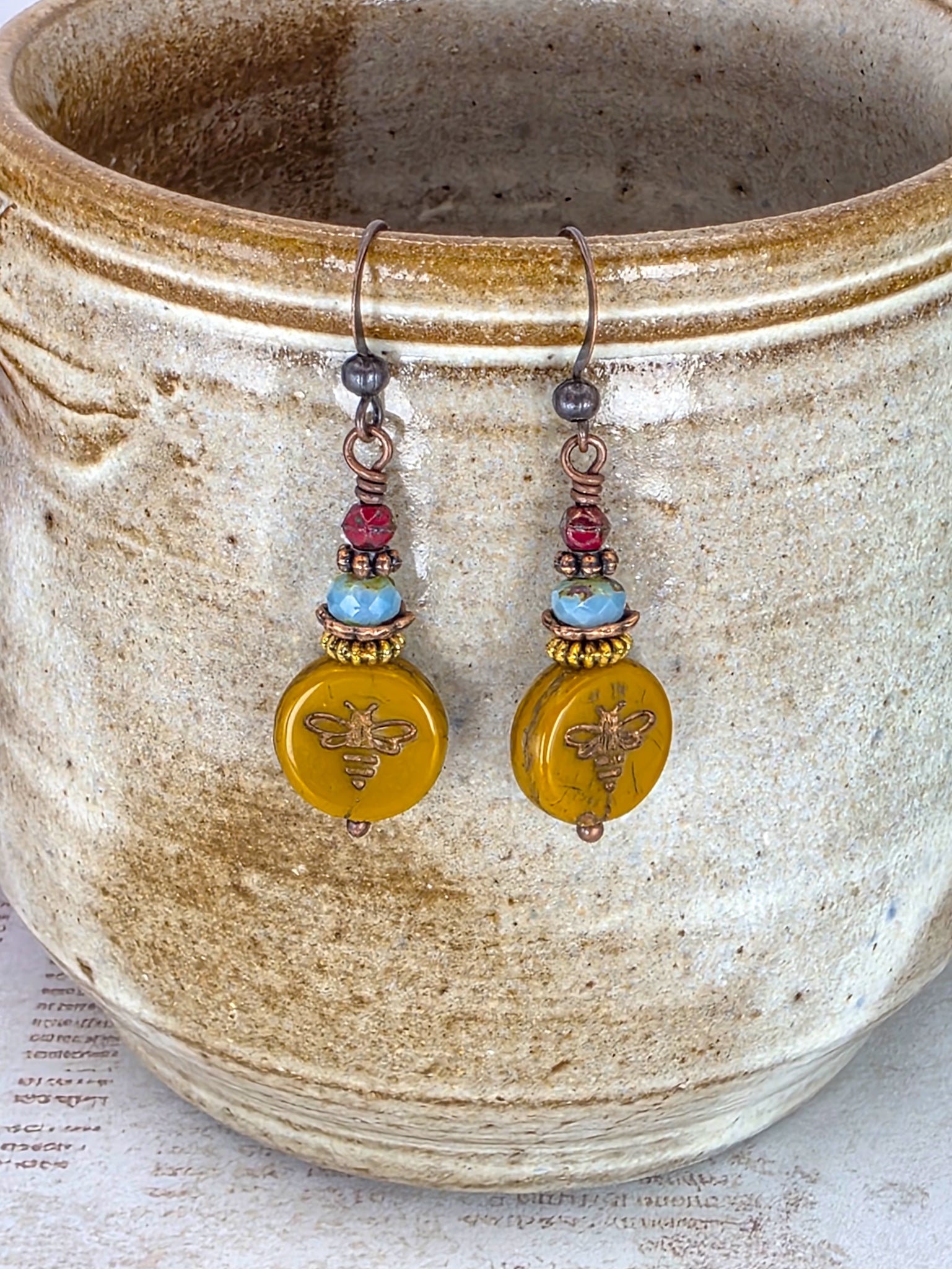 Mustard Picasso Czech glass bee earrings with copper ear wires and brass accents.