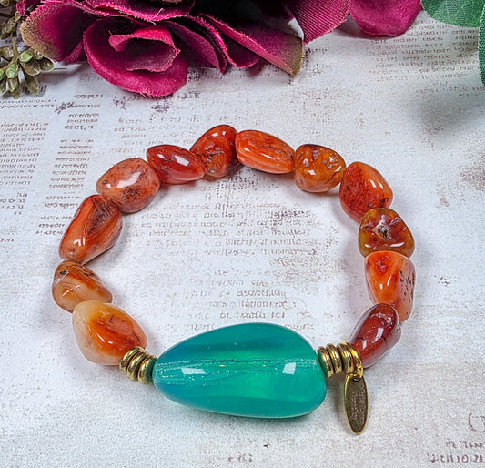 Carnelian beaded bracelet with large aqua Czech glass focal bead and brass accents