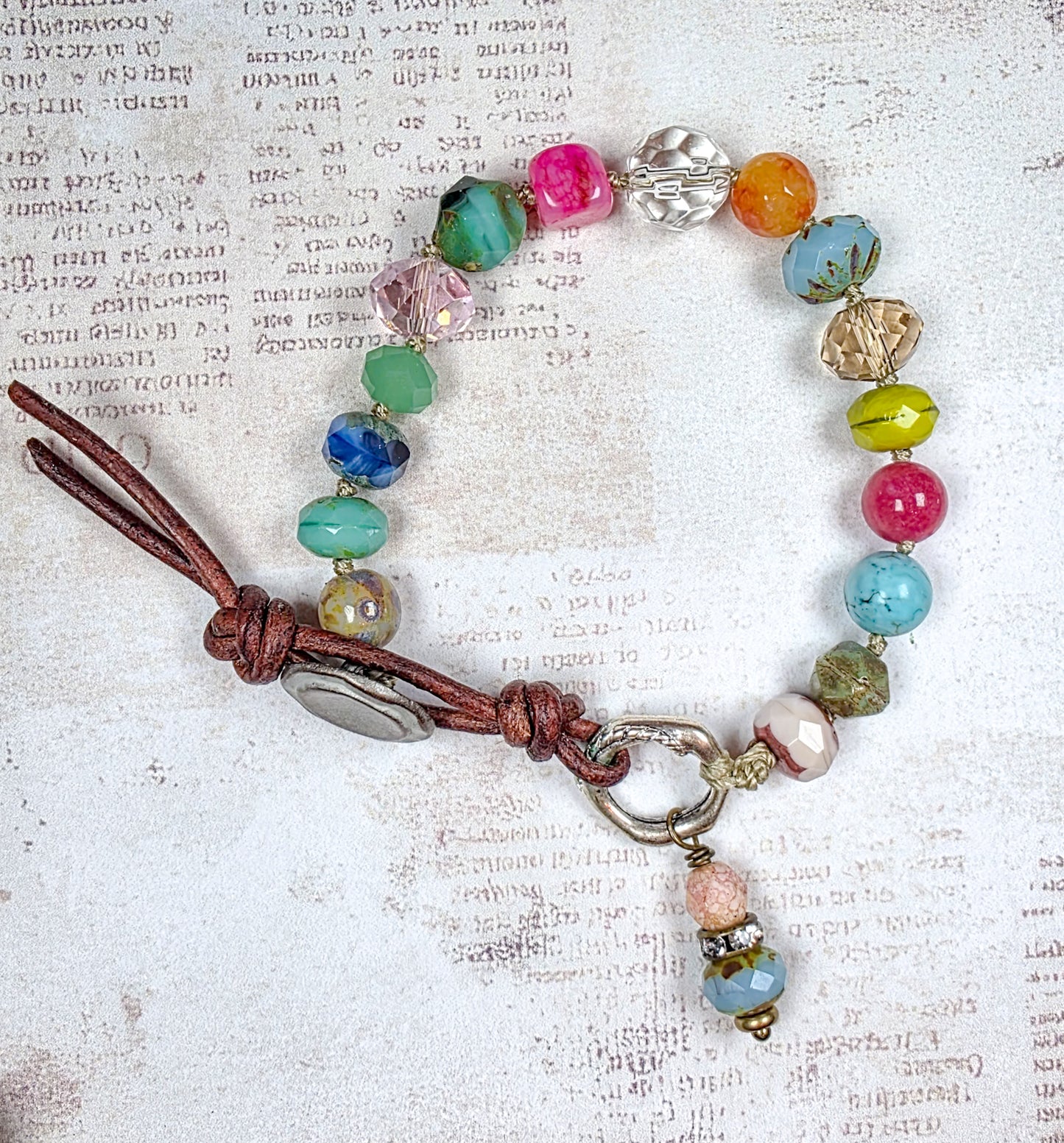 Colorful hand knotted Czech glass bead bracelet with leather button closure