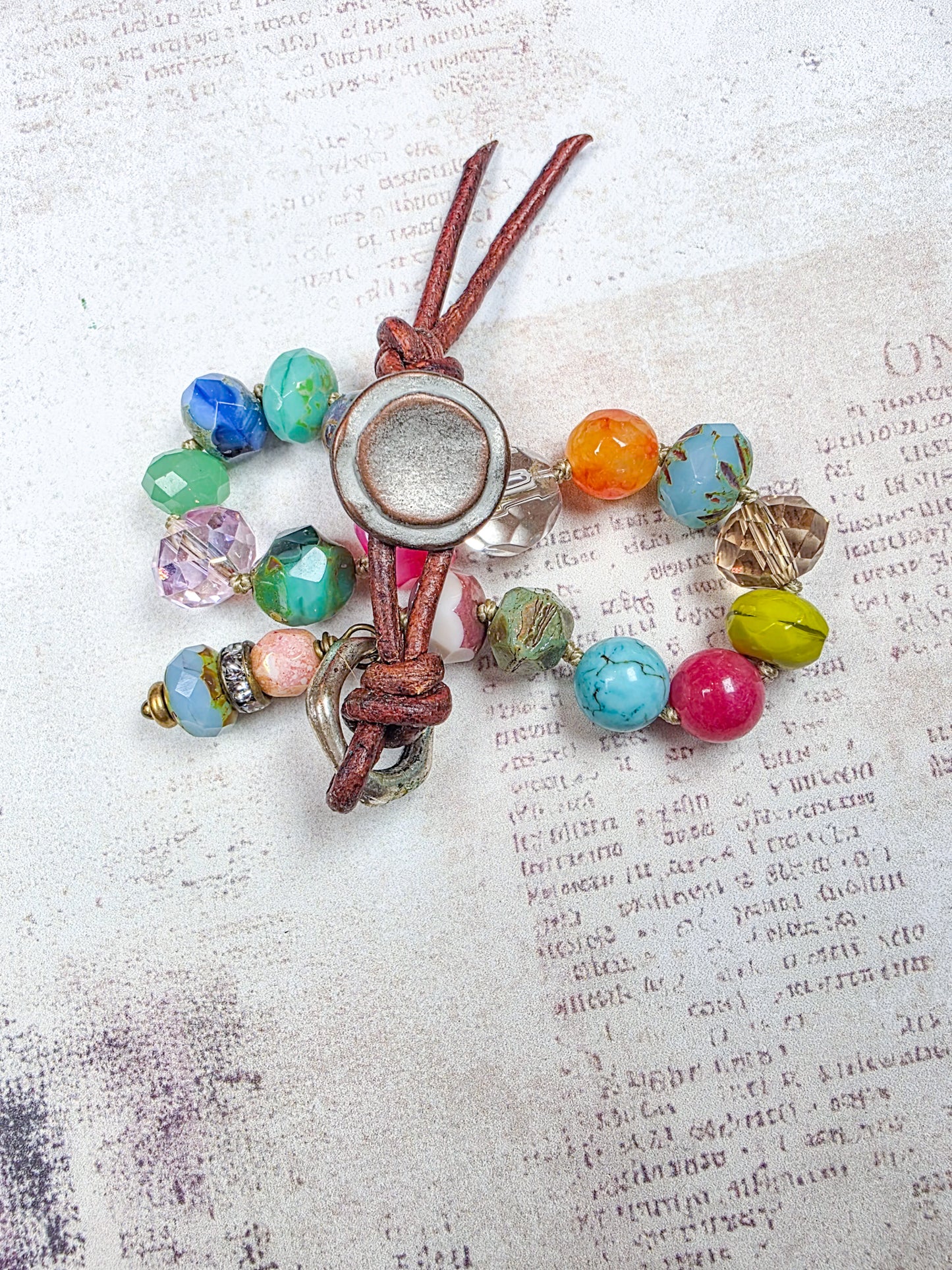 Colorful hand knotted Czech glass bead bracelet with leather button closure