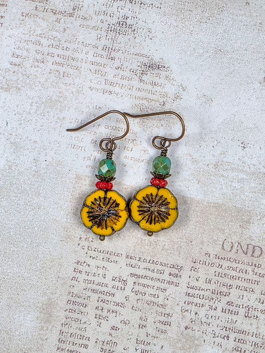 Mustard yellow Czech glass flower earrings with green and red beads and antiqued brass accents