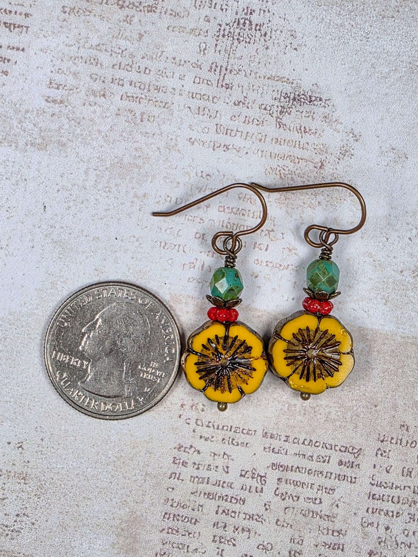 Mustard yellow Czech glass flower earrings with green and red beads and antiqued brass accents
