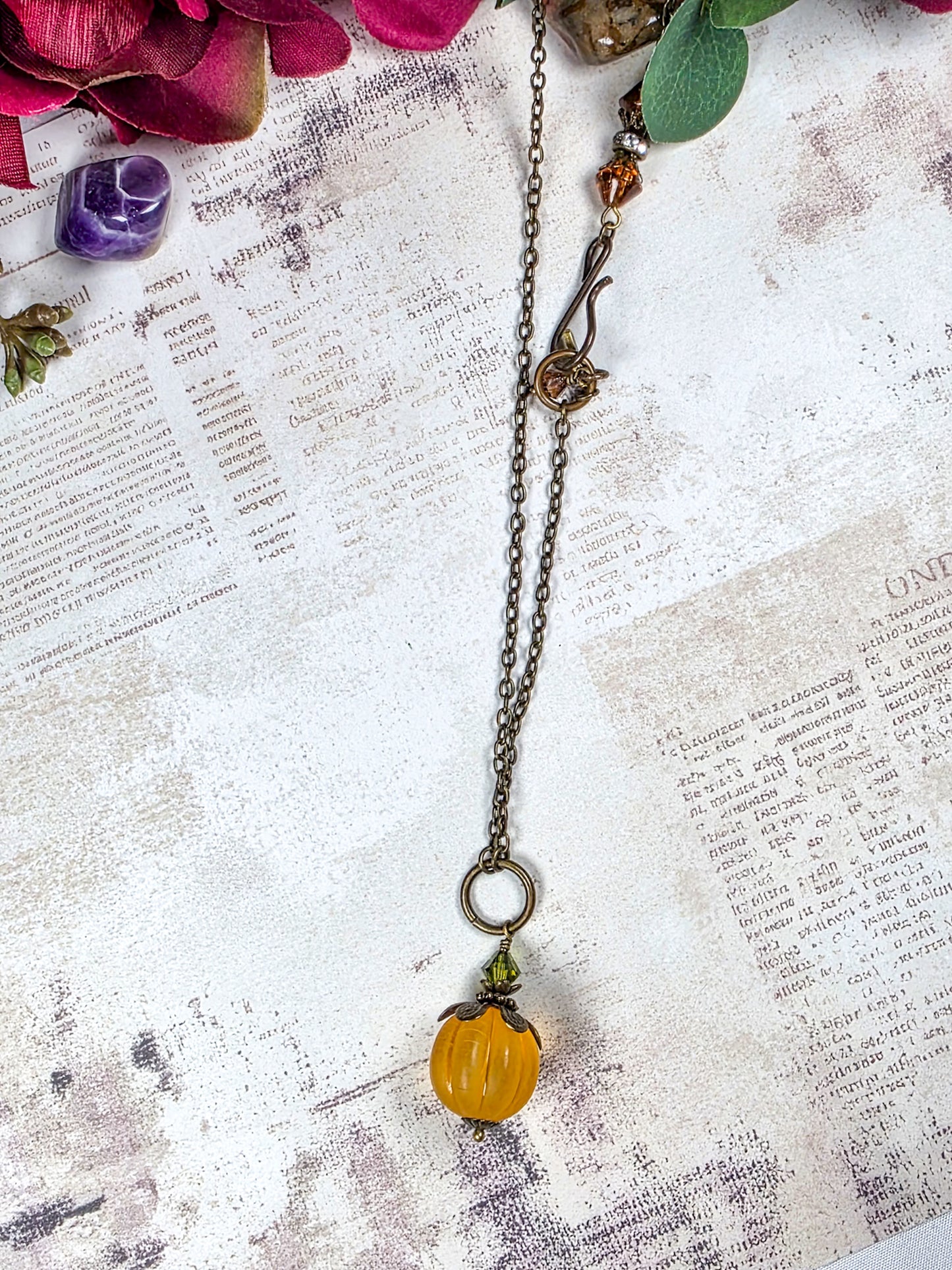 Long orange lucite pendant necklace with Swarovski crystal and antiqued brass accents