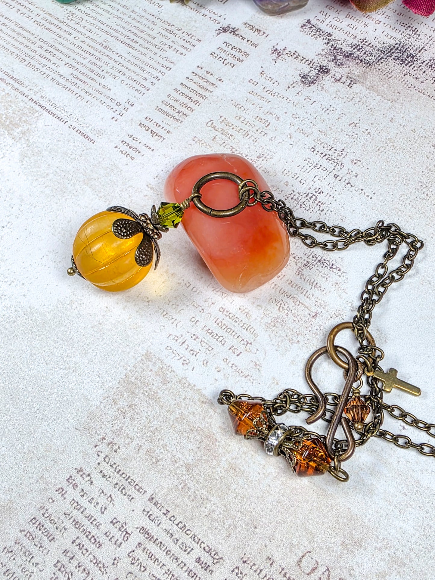 Long orange lucite pendant necklace with Swarovski crystal and antiqued brass accents