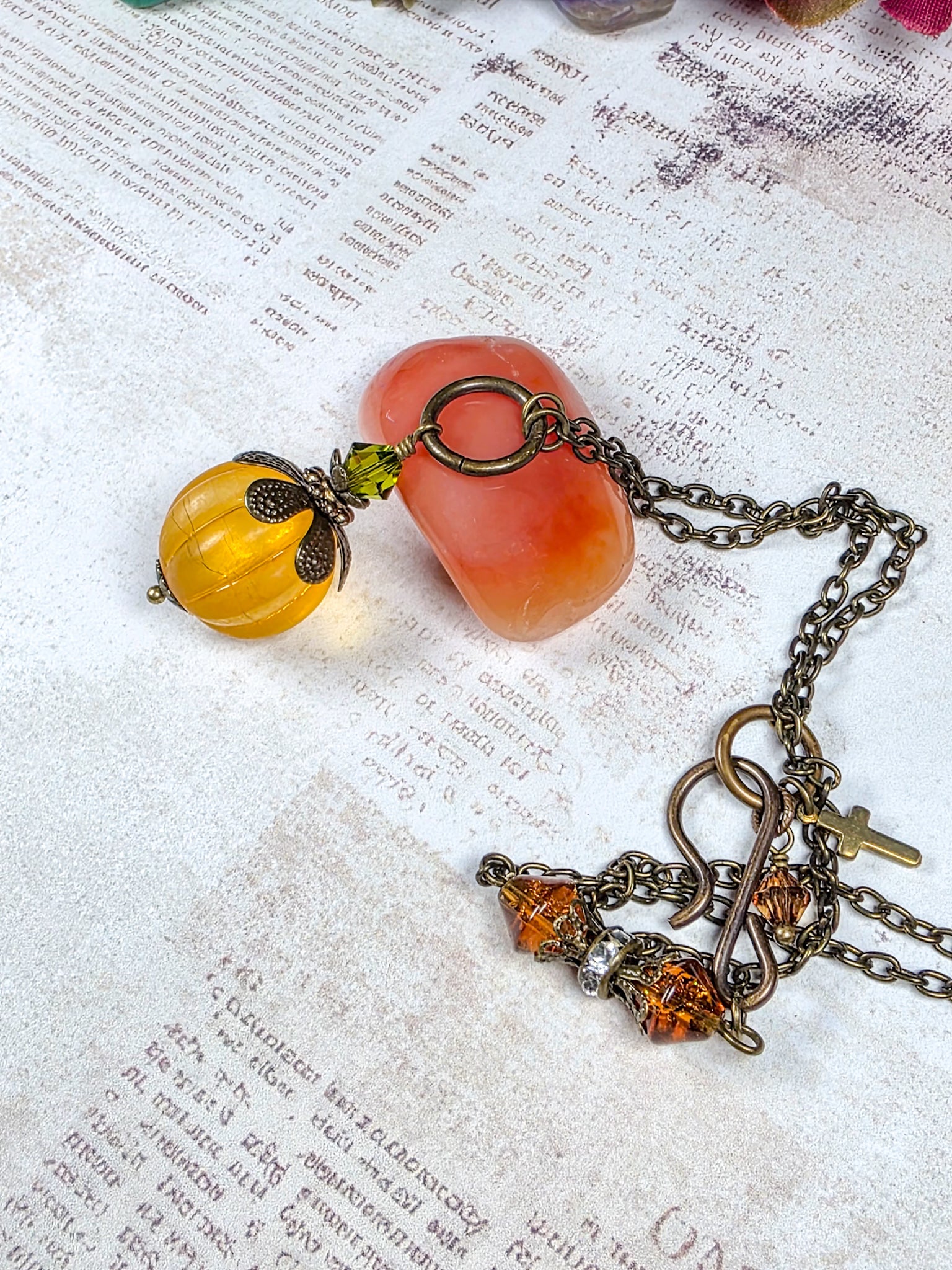 Long orange lucite pendant necklace with Swarovski crystal and antiqued brass accents