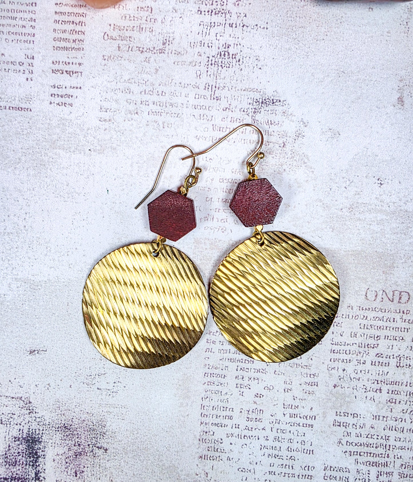 Brass and dark wood geometric dangle earrings with textured round discs