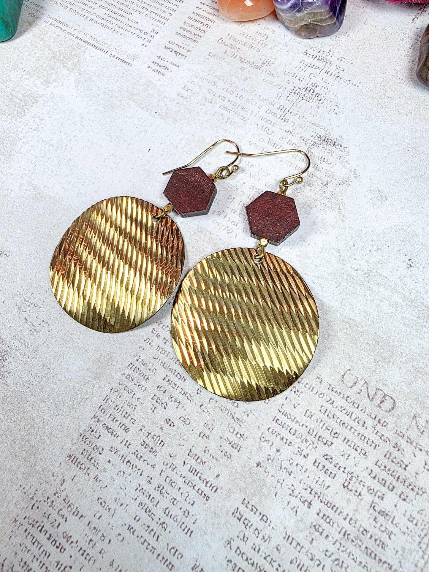 Brass and dark wood geometric dangle earrings with textured round discs