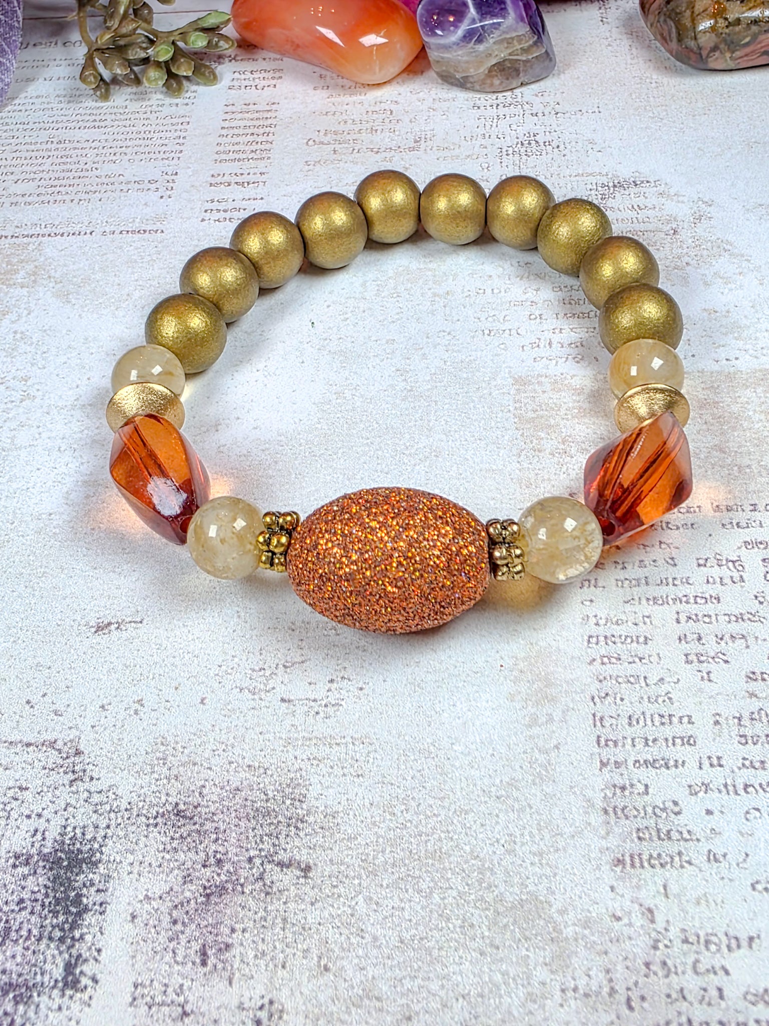 Earthy terracotta beaded stretch bracelet with burnt orange acrylic and bronze-gold wood beads