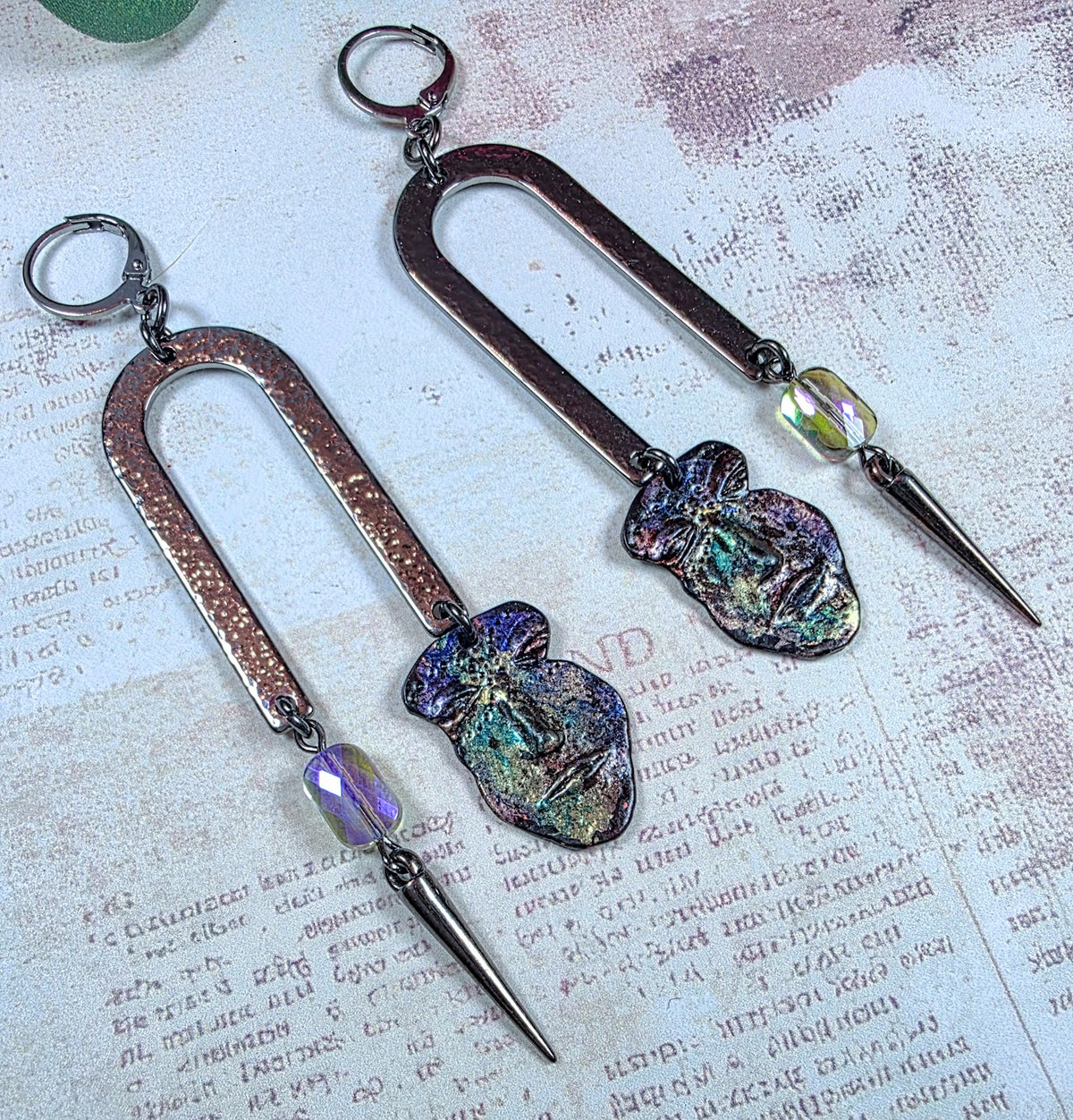 Pewter face dangle statement earrings with hammered metal arches, colorful glass beads and spike charms