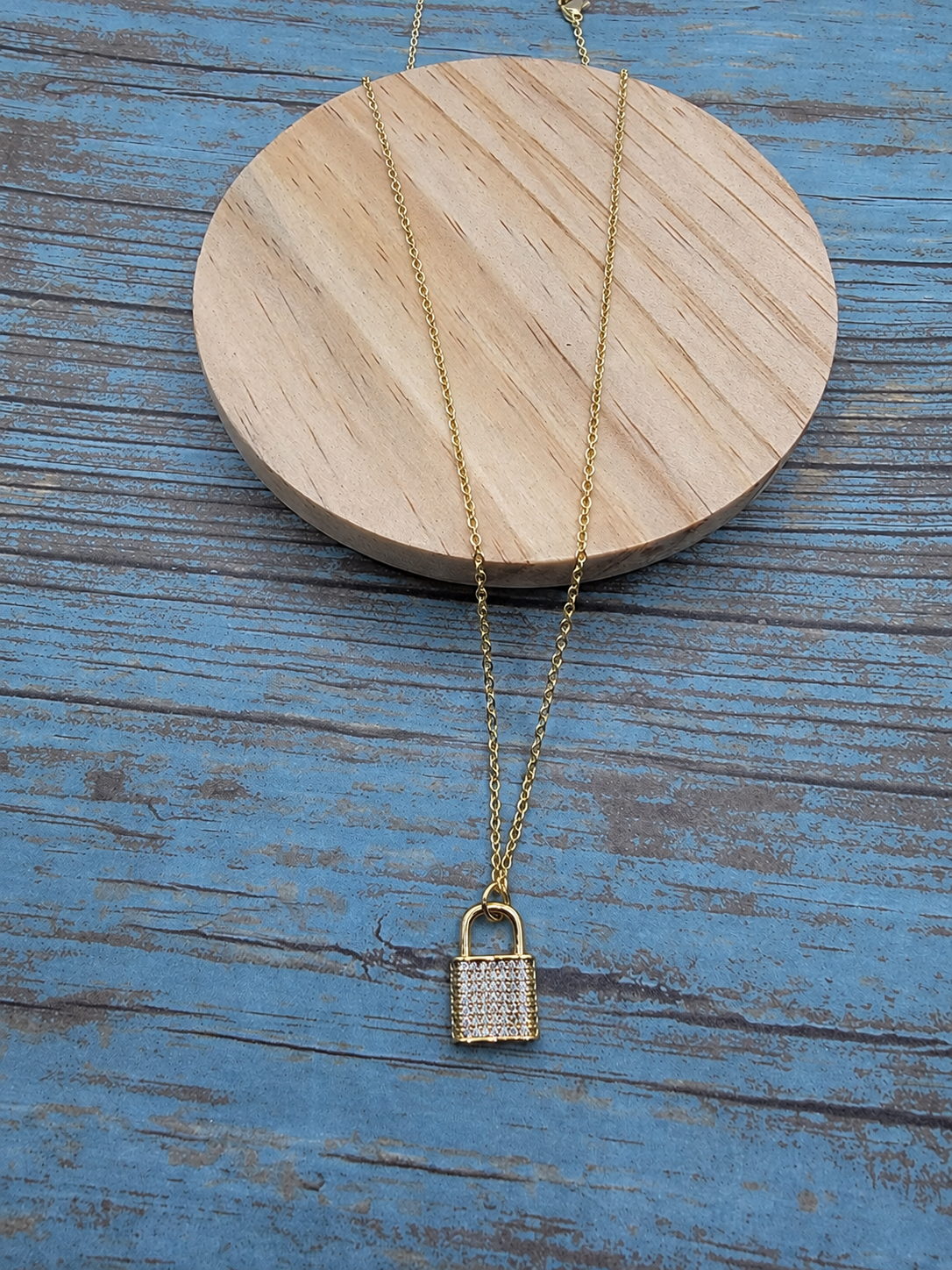 Gold cubic zirconia pavé lock pendant necklace on 16-inch chain