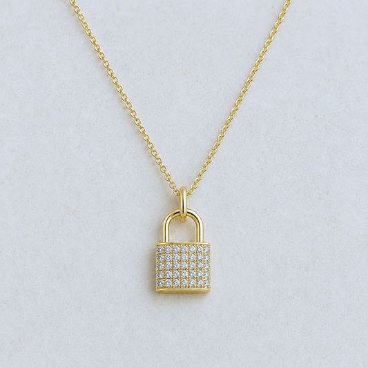 Gold cubic zirconia pavé lock pendant necklace on 16-inch chain