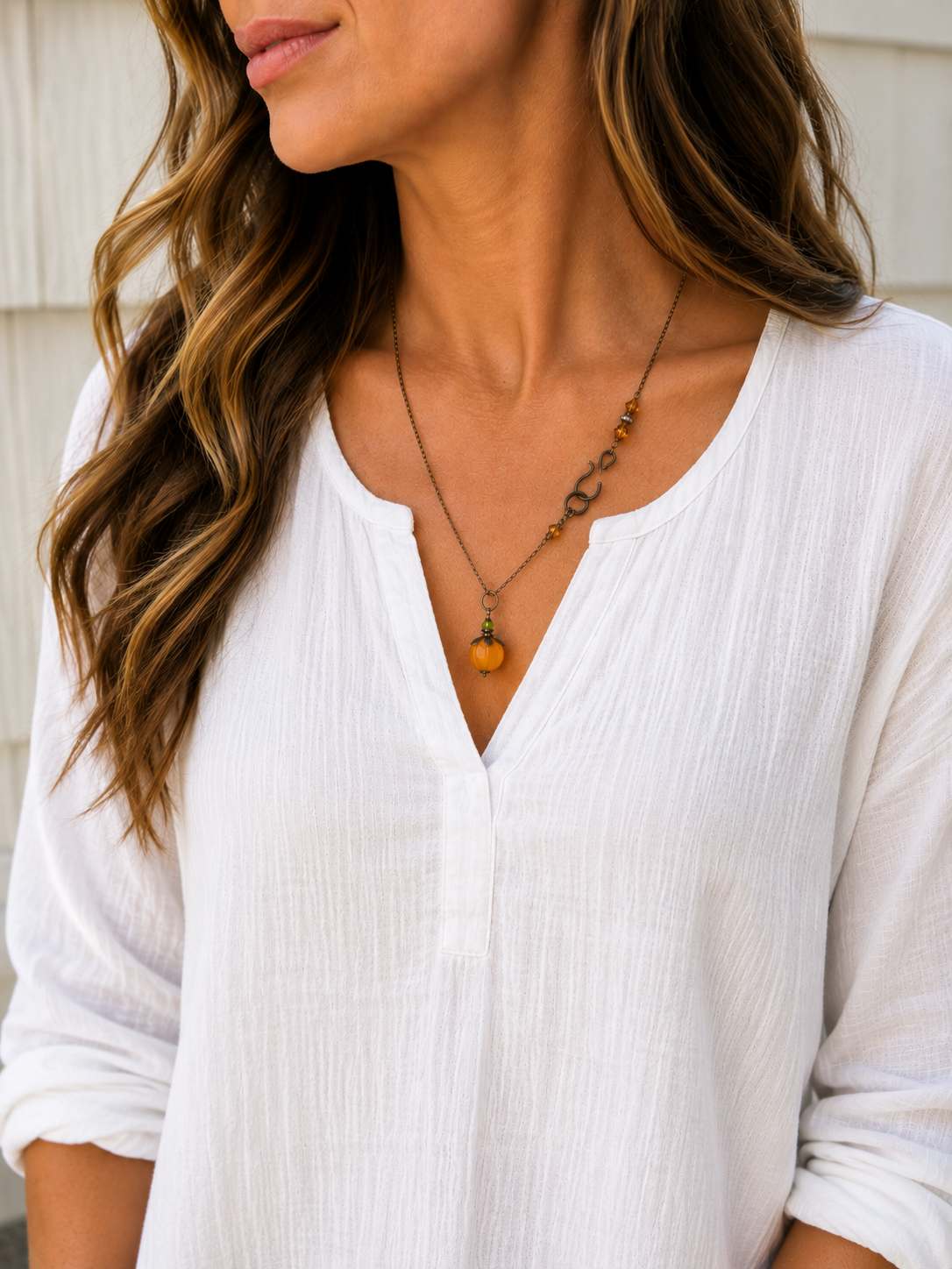 Long orange lucite pendant necklace with Swarovski crystal and antiqued brass accents